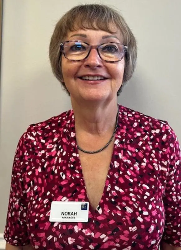 RCH | Smiling resident taking part in a music therapy session at Woodlands Care Centre