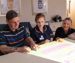 RCH | Residents enjoying a group activity together at Woodlands Care Home